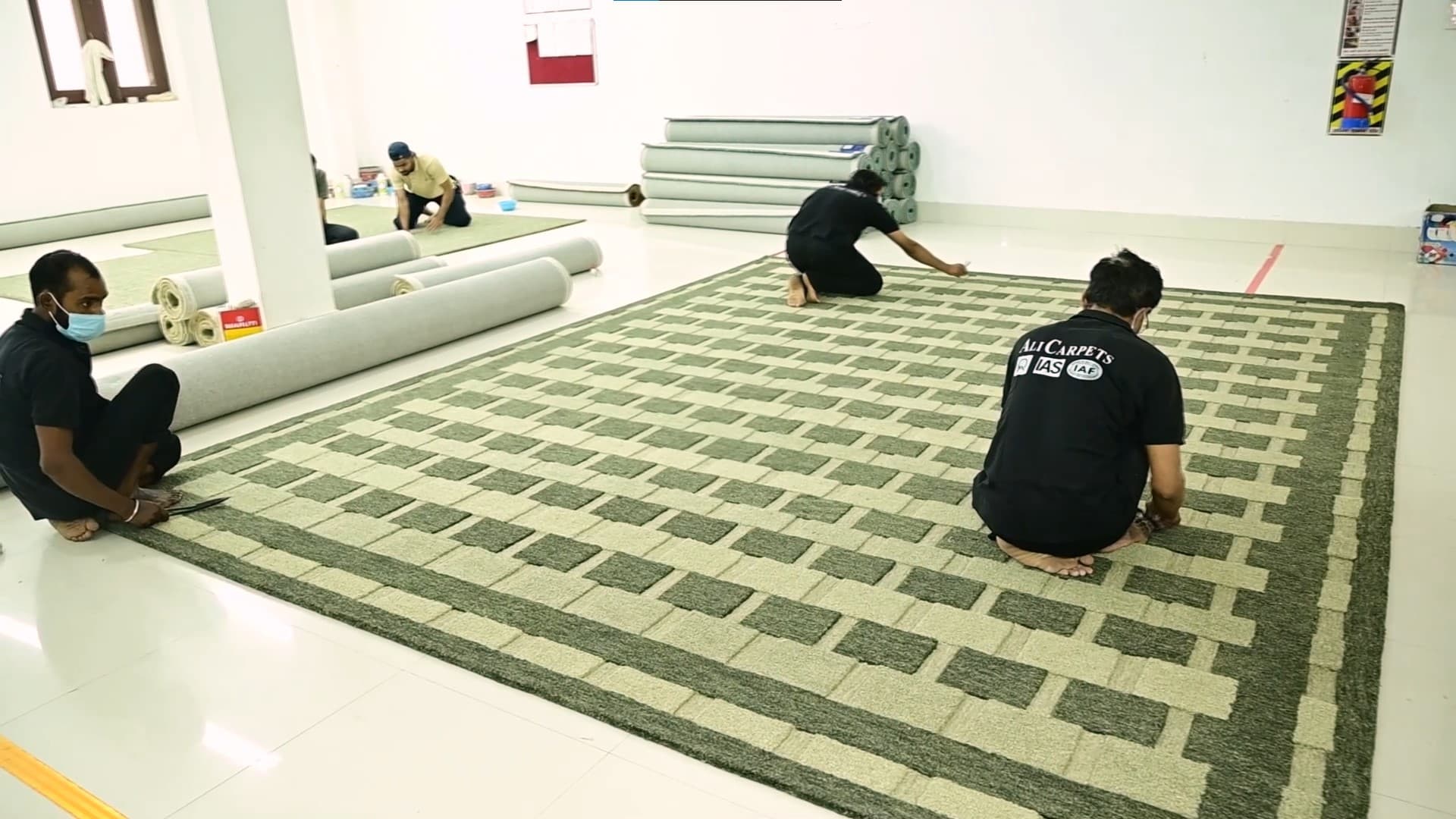 Skilled artisan hand-weaving a traditional carpet